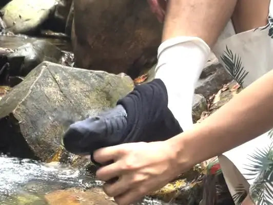 Removing Konugo waterproof socks to show dry inner socks